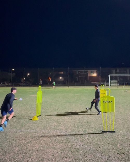 Coach Chris working with a senior player on advanced technique